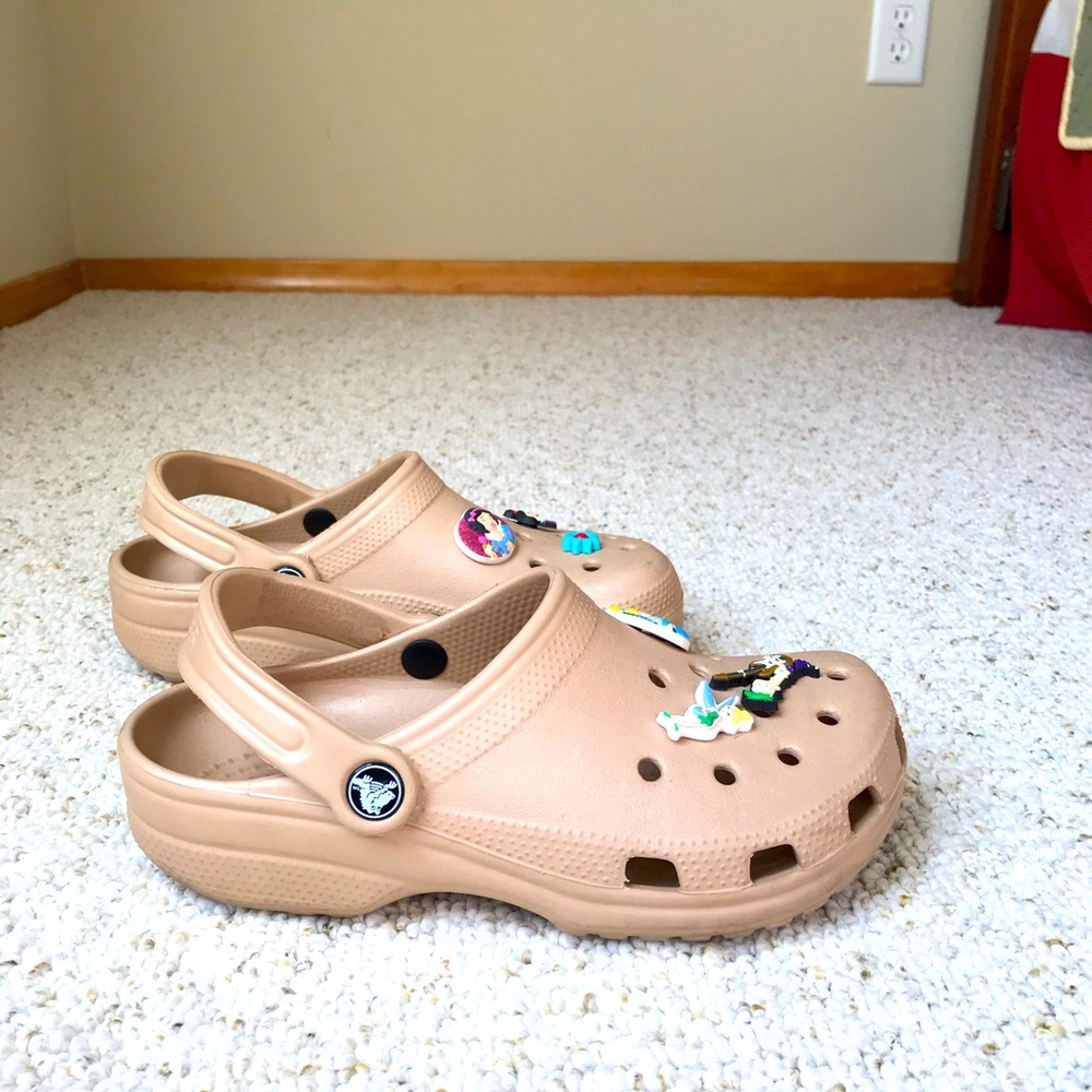 Crocs: gold, neutral, size 7.  Charms included